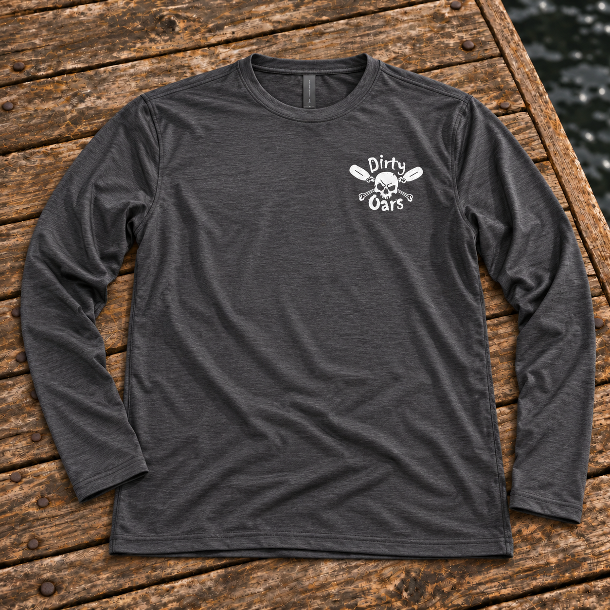 Front of the charcoal Current Runner performance shirt on weathered dock planks