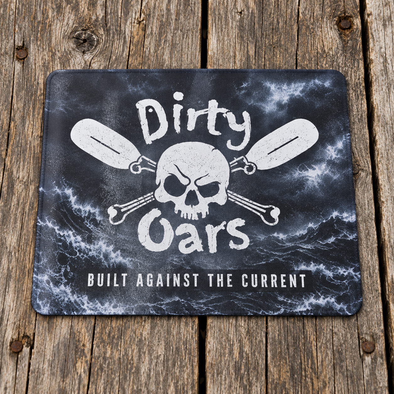Dirty Oars mouse pad on weathered dock planks